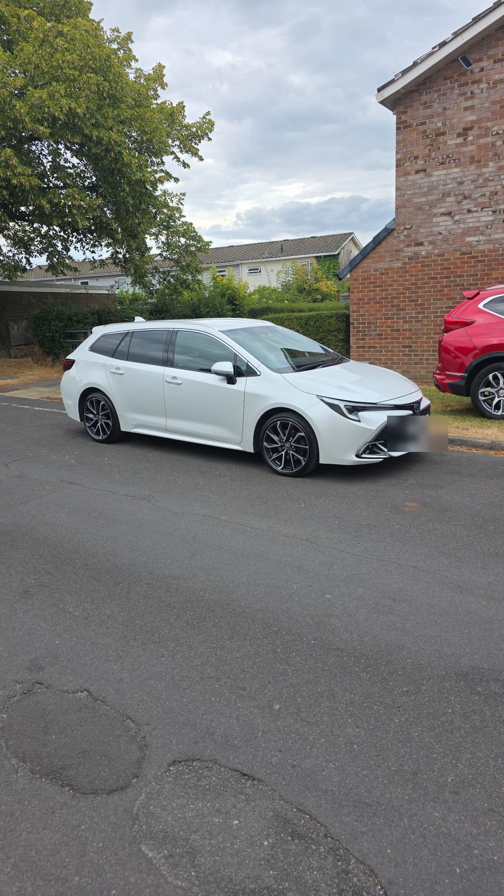 BA Luxe Toyota Corolla Excel in pearl white — side profile